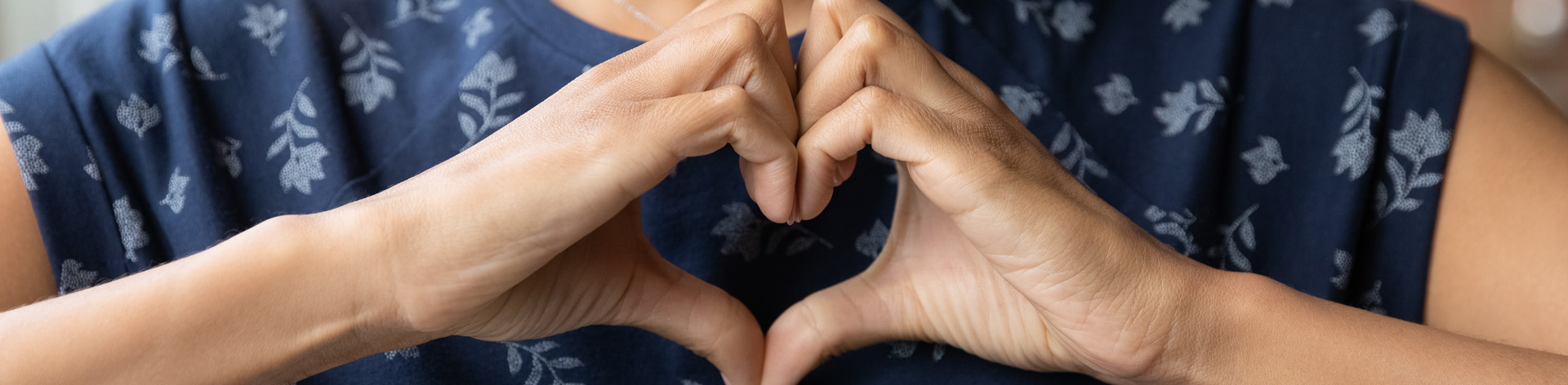 Hands shaped to form a heart.