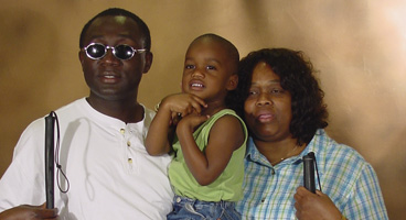 Kobena and his family pose for a photo together.